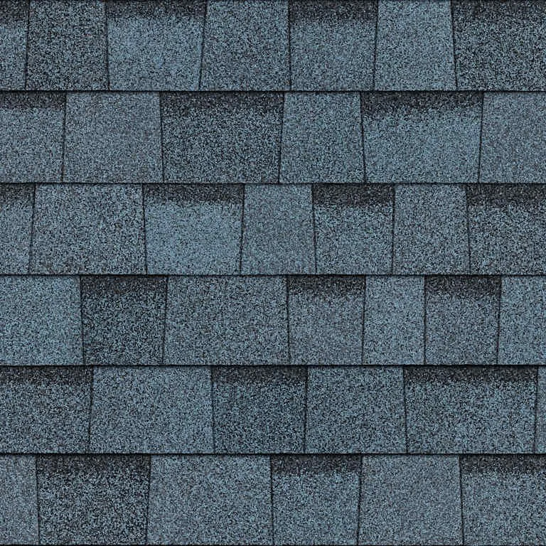 Close-up of a roof with dark gray asphalt shingles arranged in horizontal rows.